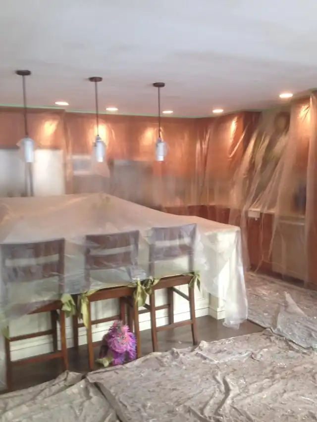 Another room covered in plastic ahead of painting