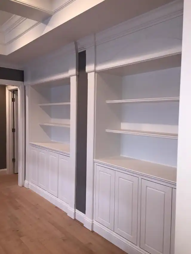 White built-in shelving over wainscot